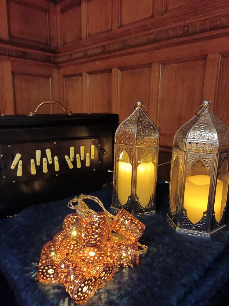 Shruti box, lanterns and fairy lights glowing