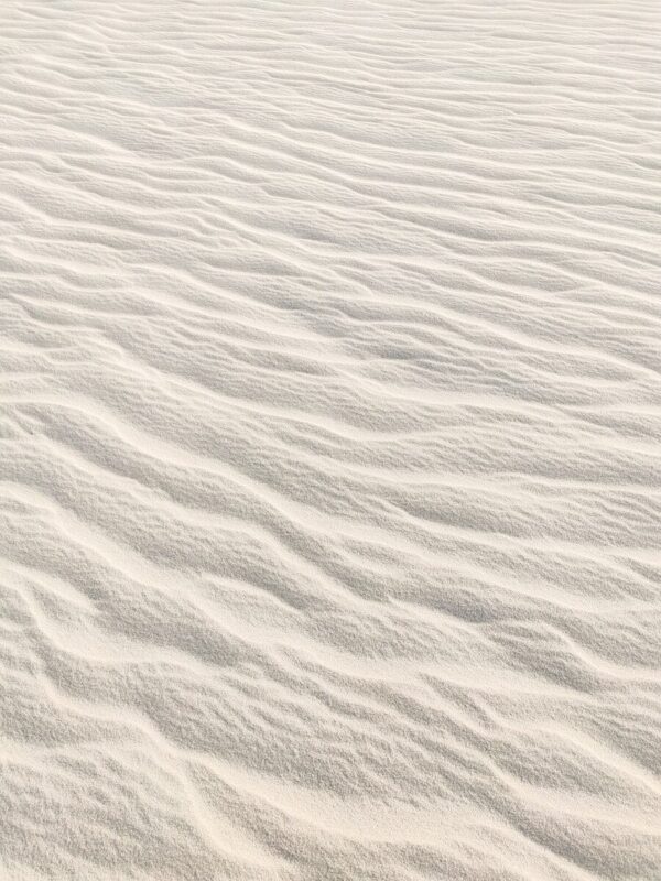 white sand with water during daytime