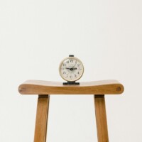 brown wooden table clock at 10 10